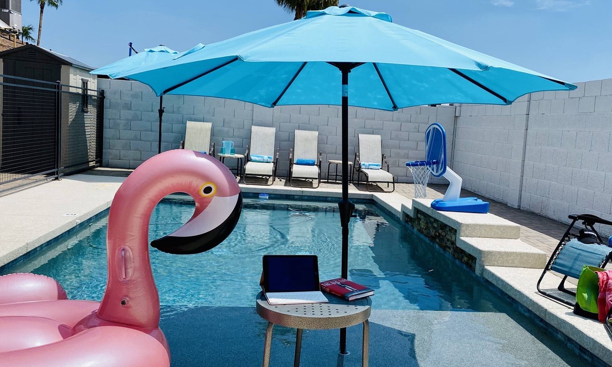 Phoenix House | Resort Style Backyard- Heated Pool, Putting Green, Outdoor TV and Pool Table.
