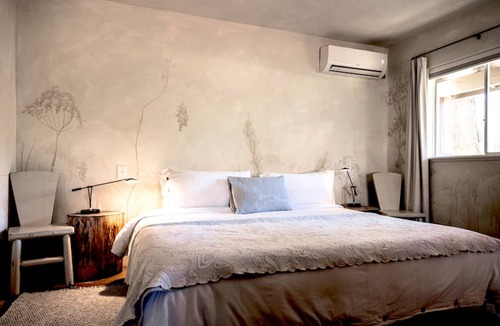 Cornville House | Enjoy our designer King Suite, nestled among the pines with premium linens, a deep soaking tub and lush gardens Experience the sunrise or sunset on the front patio in our wooden rocking chairs Close to Vineyards for Wine lovers 5 miles from