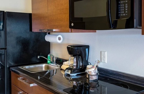 West Jordan Hotel | Modern Comfort! Full Kitchen | Near Jordan Landing– Shopping Just Steps Away!