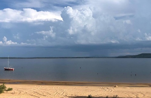 Hoyt Cabin | Private lakefront getaway with a sandy beach below the back deck!