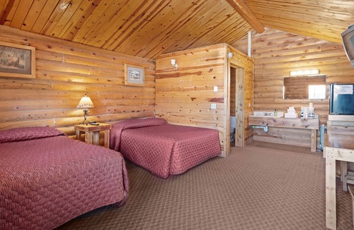 St. Charles Cabin | Rustic camping studio with large front porch & kitchenette