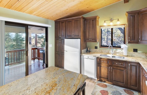Moonridge Cabin | Sunset Mountain Retreat By Destination Big Bear: Nestled in Lower Moonridge! 1 Mile Away from Bear Mountain Ski Resort, Golf Course and Zoo! Reverse Floor Plan! Air Hockey Game Table!