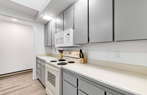 Graeagle Condo | This light-filled alpine retreat blends rustic charm with modern style.