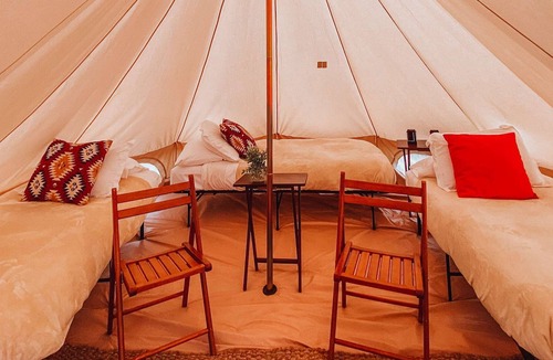 Valle House | Triple Tent w/ Shared Bathroom - Find us among the juniper trees and open sky.