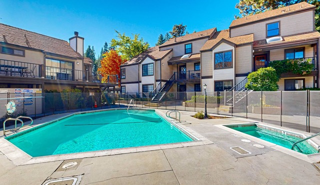 Beautiful lake-view condo w/shared pool and hot tub walk to restaurants & shops