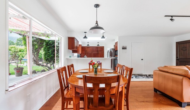 Coastal ranch-style home in garden setting.