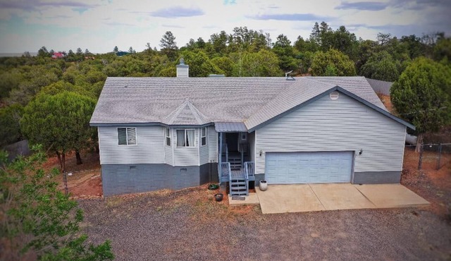 Comfortable home in the country just outside of Show Low. Space to park trailer.
