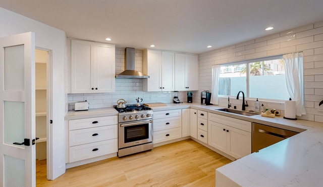 Dazzling, spacious, & completely remodeled home with a chef’s dream kitchen in Sunset Beach