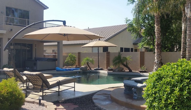 Great House with a jacuzzi, pool, outdoor fireplace & a large backyard!