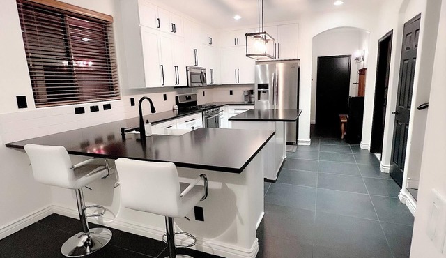 Minimalist home with pool and private office ideal for professional travelers.