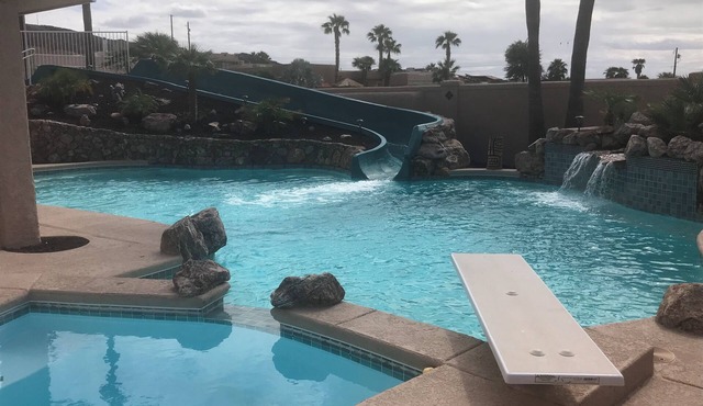 Resort Style pool home with big waterslide and game room