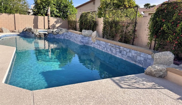 Spacious 5 bedroom home with pool and games.