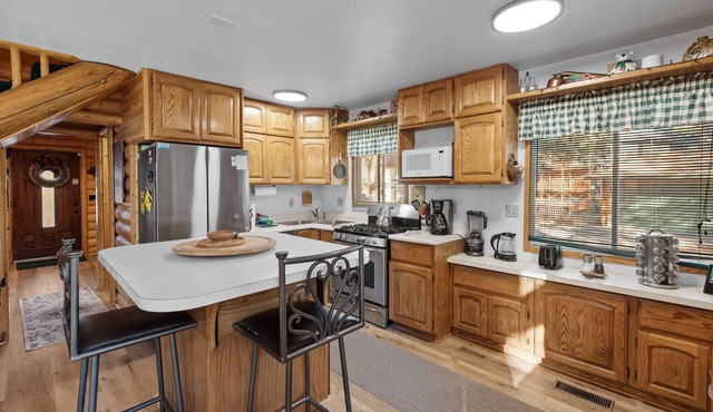 The Hideaway - Enchanting custom log-style home nestled high in the pines! Great room features!