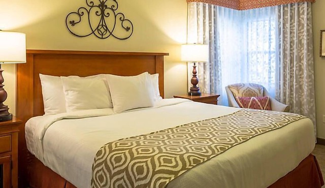 UpScale Resort with Outdoor Heated Pool with a waterslide and a poolside bar, tennis court and gym