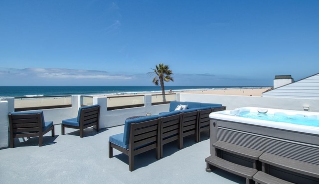 Beautiful, one-of-a-kind upper unit with incredible roof-top deck with hot tub